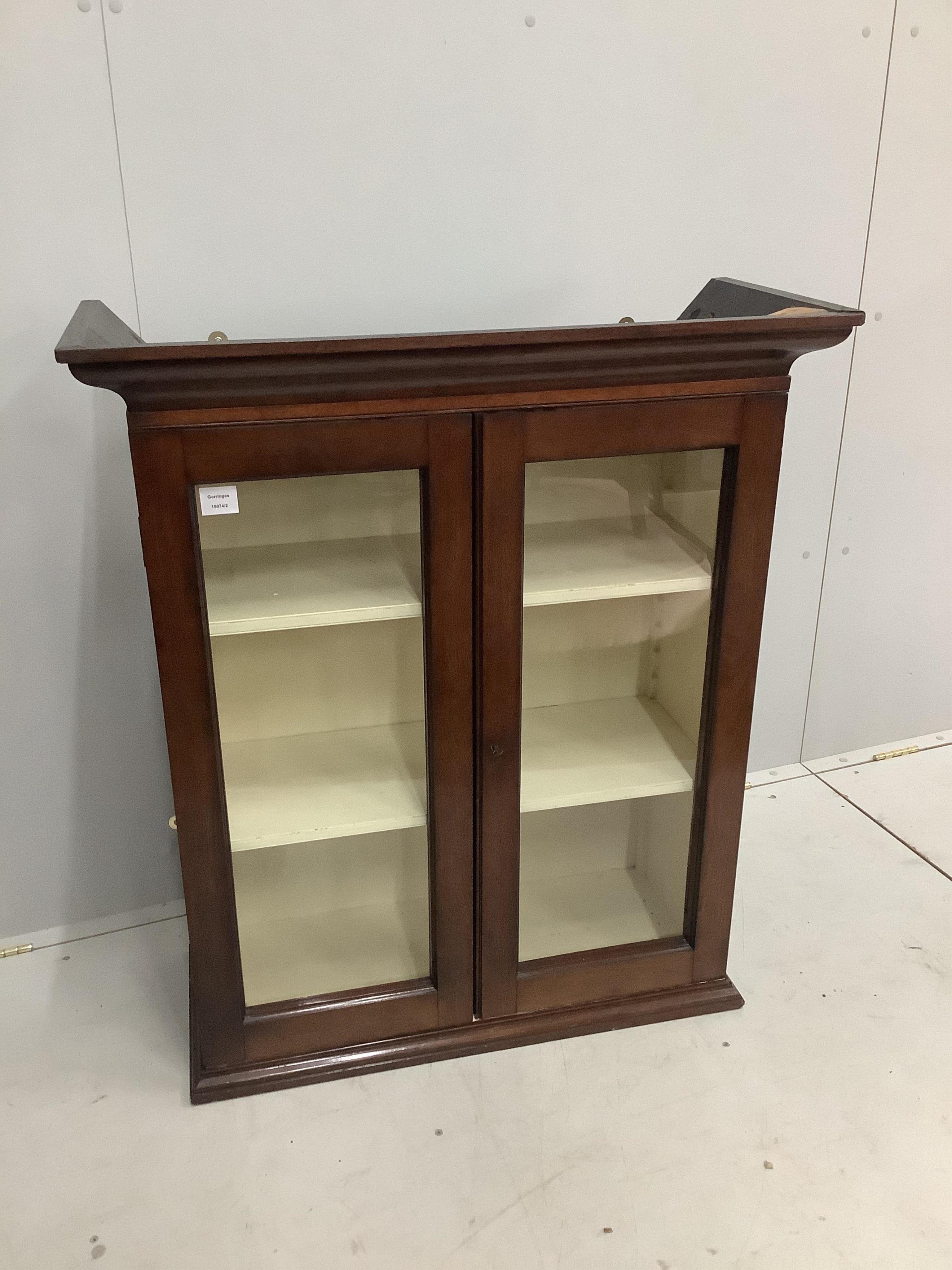 A Victorian glazed mahogany two door wall cabinet, width 86cm, depth 36cm, height 101cm. Condition - good